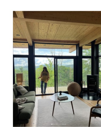 Dr. Emilie Vos in the hintercabin living room overlooking the forest view