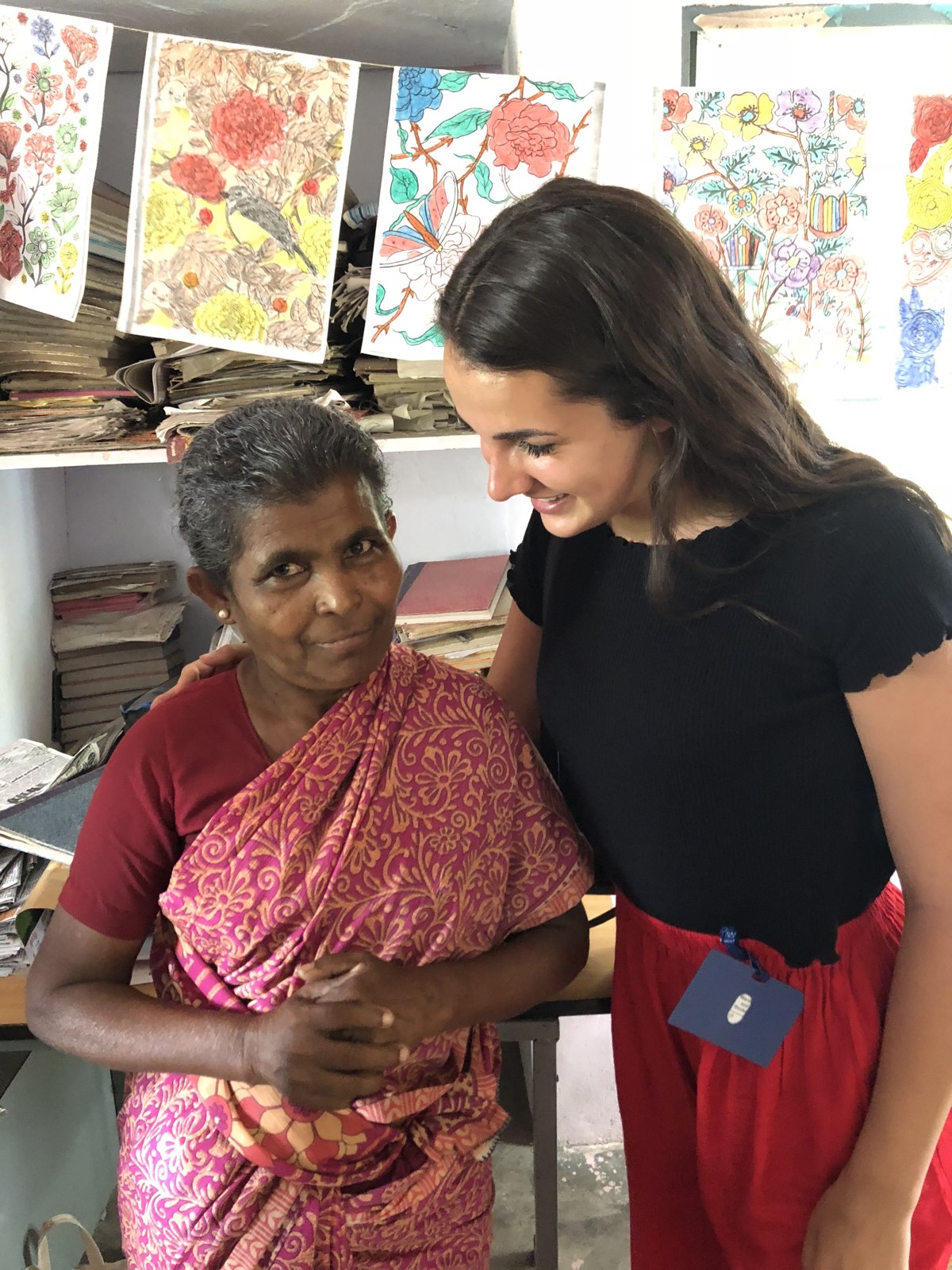 Dr. Emilie Vos with a community member during a health outreach visit in India